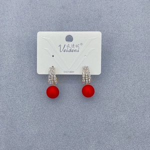 Detail view of S925 silver needle pearl earrings with red frosted beads and rhinestones