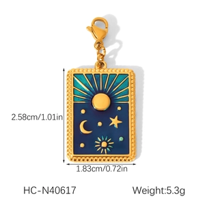 Detailed view of gold celestial charm with blue enamel and dimensions: 2.58cm by 1.83cm