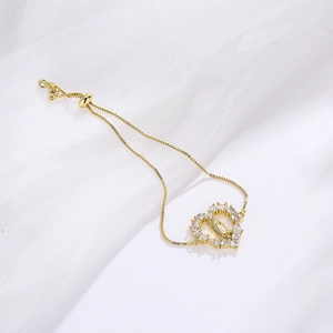 Adjustable gold plated heart bracelet with Virgin Mary relief and sparkling cubic zirconia