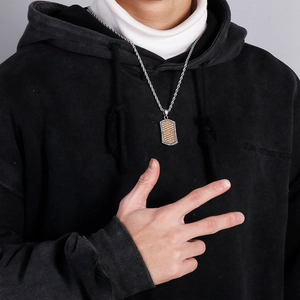 Hip hop titanium steel dog tag necklace with gold woven pattern and diamond inlay on male model