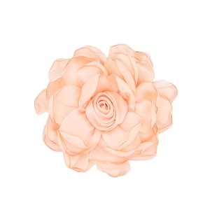 Detailed close-up of a handmade soft pink satin fabric rose flower accessory with fine texture