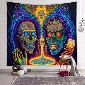 Psychedelic skull tapestry hanging on a white brick wall in a cozy room setting