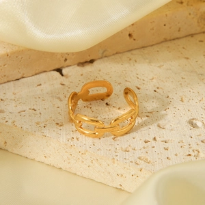 Detailed view of an 18K gold-plated chain-link adjustable ring on a stone display