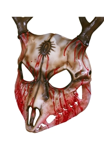 Detail view of scary ram skull mask with realistic horns and red blood splatter textures