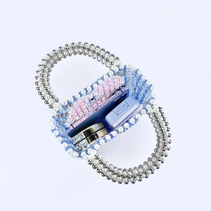 Detail view of large capacity blue heart beaded bag interior with phone and mirror