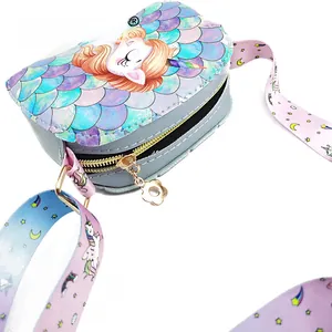 Detail of unicorn crossbody bag showing iridescent fish scale texture and floral zipper