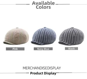 Flat lay of newsboy caps in pink, navy blue, and dark grey striped cotton linen fabric