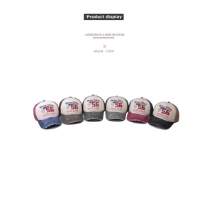 Detailed grid of vintage washed denim baseball caps with distressed brims and 56 embroidery