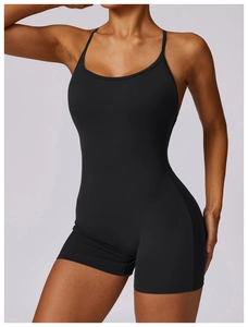 Close-up of black quick-dry bodysuit with thin straps and low back for yoga fitness