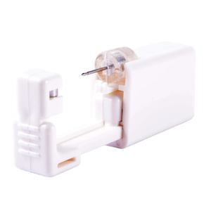 Single-use disposable ear piercing gun tool in white with sterile steel needle for earlobes
