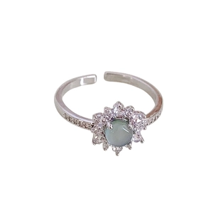 Adjustable floral open ring in silver with a round moonstone and sparkling crystals