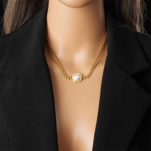 Luxury gold plated wheat chain necklace with square pearl pendant on a model