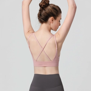 Pink high-impact sports bra for women featuring criss-cross back straps and wide elastic hem