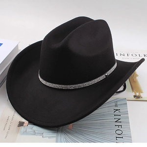 Detail of black wool cowboy hat featuring a sparkling rhinestone-studded metal hatband