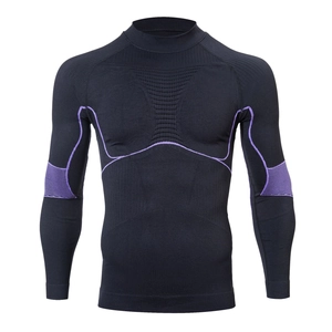 Detail of men's compression top with purple stitching and breathable textured zones