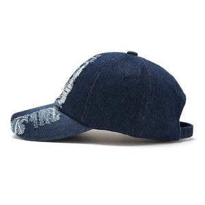 Distressed dark blue denim baseball cap for men and women featuring vintage frayed edges