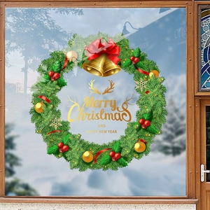 Sticker de fenêtre couronne de Noël verte avec baies rouges et lettrage festif