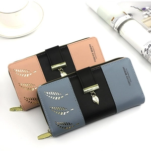 Women's long bifold wallet featuring hollow leaf design and patchwork color contrast detail