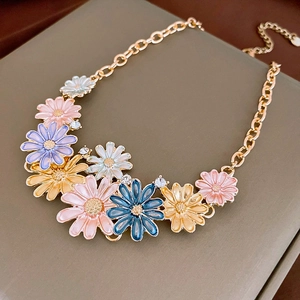 Vintage gold-plated floral necklace with colorful enamel petals and sparkling rhinestones