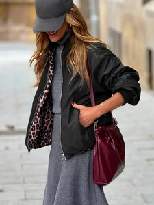 Elegant reversible leopard print jacket with burgundy accents and zip-up casual design