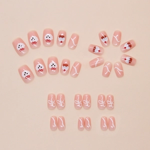 Détails de faux ongles courts motif chien dessin animé avec nœuds et gâteaux mignons