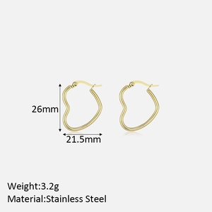Detail view of gold stainless steel heart hoop earrings with 26mm by 21.5mm size specs