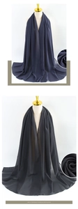Close-up of premium pearl chiffon fabric in navy blue and black colors showing soft texture