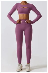 Three-piece yoga set featuring hollow-out crop top, sports bra, and high-waisted leggings