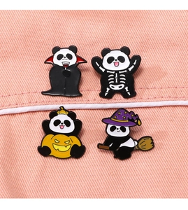 Detail of four Halloween panda enamel pins featuring vampire, pumpkin, and witch designs