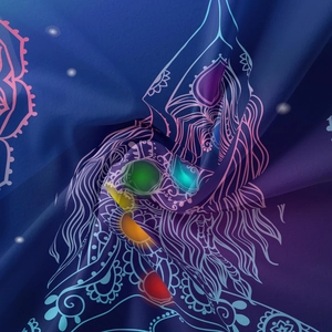 Detail of bohemian tapestry fabric showing blue purple gradient and chakra line art