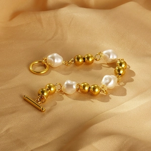 Elegant 18k gold plated stainless steel bracelet with white pearls and OT toggle clasp