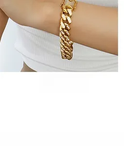 Close-up of gold plated Cuban chain bracelet featuring dense micro-pave zircon setting