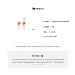 Detail view of sparkling rhinestone feather tassel earrings with product dimensions