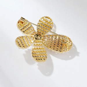 Golden camellia flower brooch with pearl inlay and 925 silver pin back view