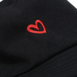 Classic black cotton bucket hat with a red heart embroidery detail for spring