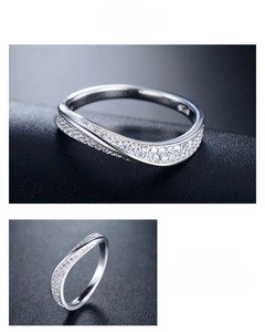 Detailed macro view of wavy sterling silver ring featuring micro-pave cubic zirconia stones
