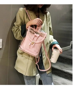Detail of pink inner pouch with drawstring and metallic buckle inside transparent PVC backpack