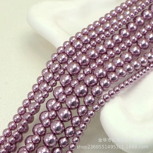 Detailed view of assorted lavender purple pearl beads in various sizes for DIY jewelry making