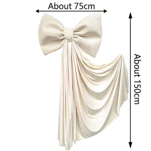 Detail of a large cream decorative bow with dimensions 75cm wide and 150cm long
