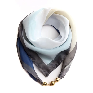 Chiffon square scarf with blue geometric print and gold magnetic ball clasp closure