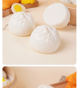 Detailed close-up of realistic PVC steamed bun keychain with soft texture and metal ring