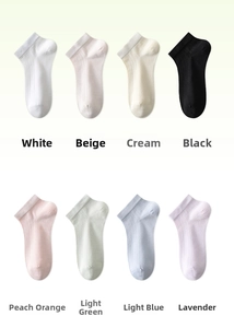 Flat lay of eight colorful silk socks with mesh texture in various pastel shades