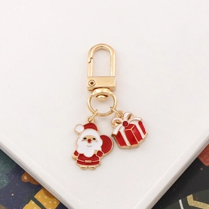 Cartoon Santa and gift box enamel keychain in gold finish with D-shaped clasp