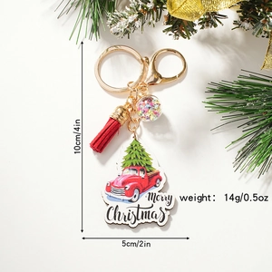 Vintage Merry Christmas keychain with red truck, pine tree, tassel and golden ring