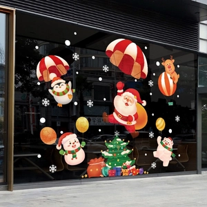 Christmas window stickers with Santa and snowman on glass, festive holiday glass decorations