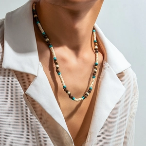 Bohemian men's necklace with turquoise and coconut shell beads on a male model