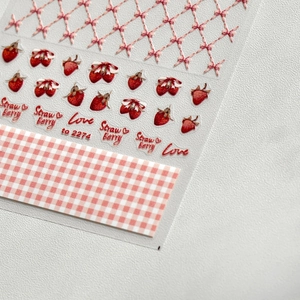 3D embossed strawberry and bow nail stickers with red grid pattern and cute accents