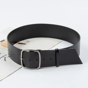 Classic black leather wide belt for women with silver rectangular pin buckle on a magazine