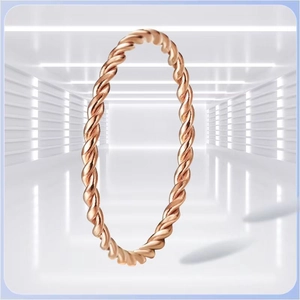 Detail of rose gold titanium steel twisted rope ring with delicate woven texture design