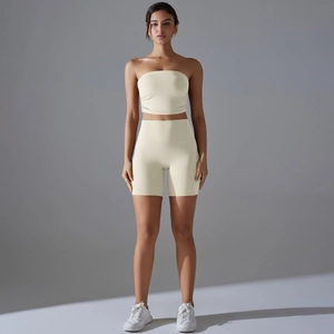 Detail view of cream white sports set with ribbed crop top and high-waisted shorts